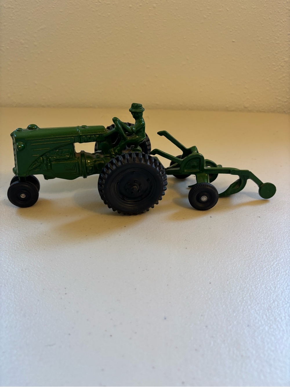 Vintage MM Green Metal Toy Tractor with Plow Attachment